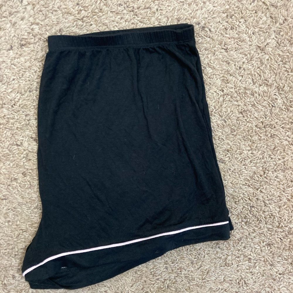 Black shortie pj bottoms W/ pale pink satin trim. NWOT fits like a L. Cool blend
